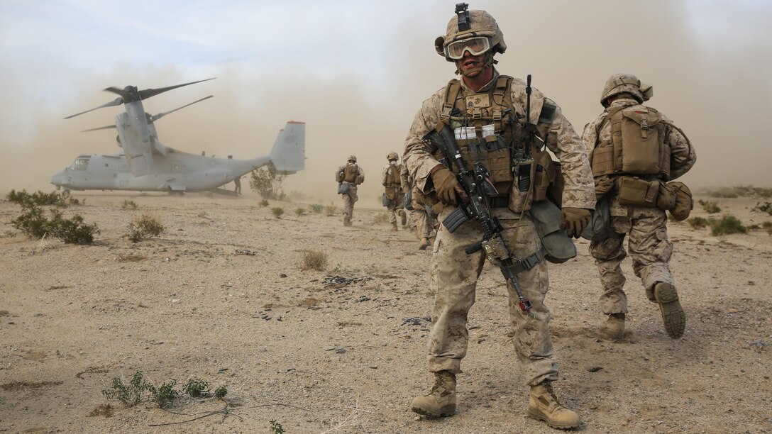Staff Sgt. Evan Eldridge provides watch for his team as they prepare to board an MV-22B Osprey during the Tactical Recovery of Aircraft and Personnel portion of the battalion’s Marine Corps Combat Readiness Exercise at Marine Corps Air Ground Combat Center Twenynine Palms, California, Dec. 3, 2015. TRAP’s placement in a MCCRE is meant to evaluate Marines on this mission set which is performed for the specific purpose of the recovery of personnel, equipment, and/or aircraft by the insertion of a TRAP force. Staff Sgt. Eldridge is a platoon sergeant with Company F, 2nd Battalion, 7th Marine Regiment, 1st Marine Division.