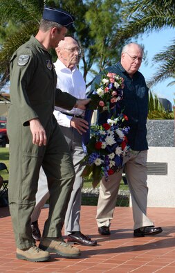 Brig. Gen. Andrew Toth, 36th Wing commander, Retired Maj. Gen. Thomas Rew and Dr. James Willbanks, director of the Department of Military History at U.S. Army Command and General Staff College,  carry a wreath during the Linebacker II remembrance ceremony Dec. 18, 2015, at Andersen Air Force Base, Guam. The ceremony honored the sacrifices service members made and observed the 43rd anniversary of Operation Linebacker II, which led to the end of the Vietnam War. (U.S. Air Force photo/Staff Sgt. Benjamin Gonsier)