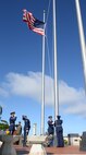 Andersen Blue Knights lower the flag to half-staff during the Linebacker II Remembrance Ceremony Dec. 18, 2015, at Andersen Air Force Base, Guam. The flag will be placed at half-staff for 11 days, signifying the number of days the Linebacker II bombing campaign lasted. (U.S. Air Force photo/Staff Sgt. Benjamin Gonsier)