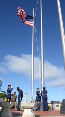 Andersen Blue Knights lower the flag to half-staff during the Linebacker II Remembrance Ceremony Dec. 18, 2015, at Andersen Air Force Base, Guam. The flag will be placed at half-staff for 11 days, signifying the number of days the Linebacker II bombing campaign lasted. (U.S. Air Force photo/Staff Sgt. Benjamin Gonsier)