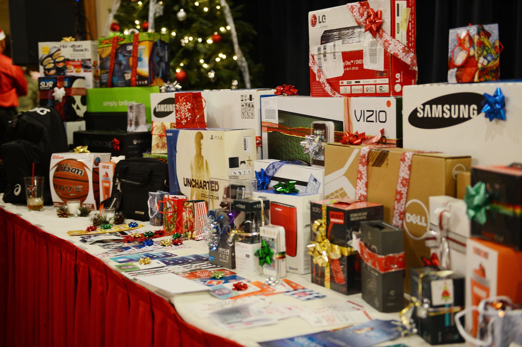 More than 200 single Airmen congregated at the Landing Zone for a chance to win gifts such as gaming systems, and flat-screen televisions during a holiday party Dec. 16, 2105 at Cannon Air Force Base, N.M. The annual event is sponsored courtesy of nearby Clovis and the Committee of Fifty, a local organization that supports Cannon and its Air Commandos. (U.S. Air Force photo/Staff Sgt. Matthew Plew)