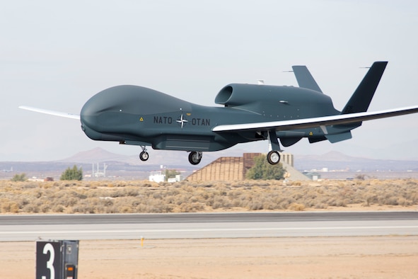 NATO's first Alliance Ground Surveillance aircraft arrived at Edwards Air Force Base, Calif., Dec. 19, 2015, completing its first flight. The aircraft took off from U.S. Air Force Plant 42 in Palmdale, Calif., and arrived at Edwards AFB. The test flight marked the start of six months of ground and airborne testing at Edwards AFB before the aircraft is sent to its new home in Sigonella, Italy. NATO AGS is a derivative of the wide-area surveillance Global Hawk, with a few small changes in the communications software to meet certain criteria for operation in Europe. (U.S. Air Force photo/Chris Okula)