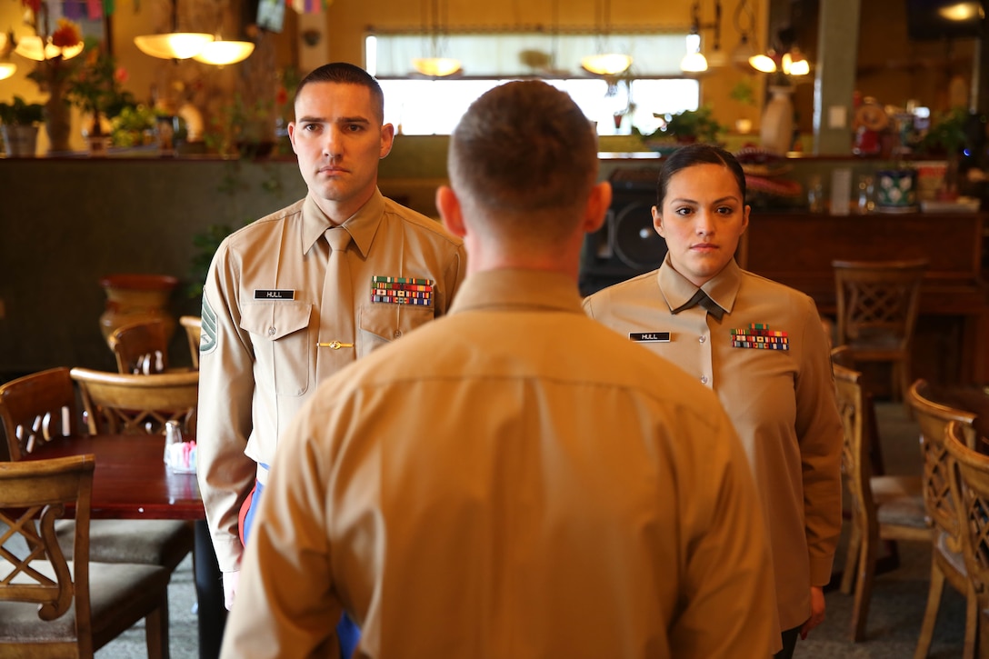 Staff Sergeants Anthony and Leslie Hull re-enlisted in the United States Marine Corps Dec. 10, 2015. This husband and wife duo has been in the Marine Corps for over a decade and plan to stay in as long as they can. The Hull's have recently successfully completed recruiting duty at Recruiting Sub Station Medford, Recruiting Station Portland, 12th Marine Corps District. The Hulls said it was a difficult assignment but their love of the Corps and the support of their family supported them every step. Anthony and Leslie both have been on combat deployments in support of Operation Iraqi Freedom and Operation Enduring Freedom. (U.S. Marine Corps photo by Sgt. Tyler C. Vernaza/released)