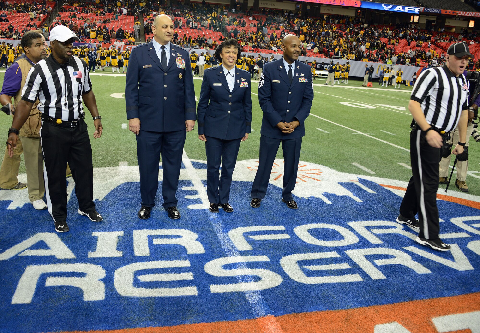 Air Force Reserve Command leadership take the field for the coin toss at the Air Force Reserve Celebration Bowl Dec 19 in Atlanta. The game featured the champions from the SWAC and MEAC in a winner take all the championship of Historicall Black Colleges and Universities. North Carolina A&T defeated Alcorn State 41-34 in a exciting game. (Air Force photo/Master Sgt Chance Babin)