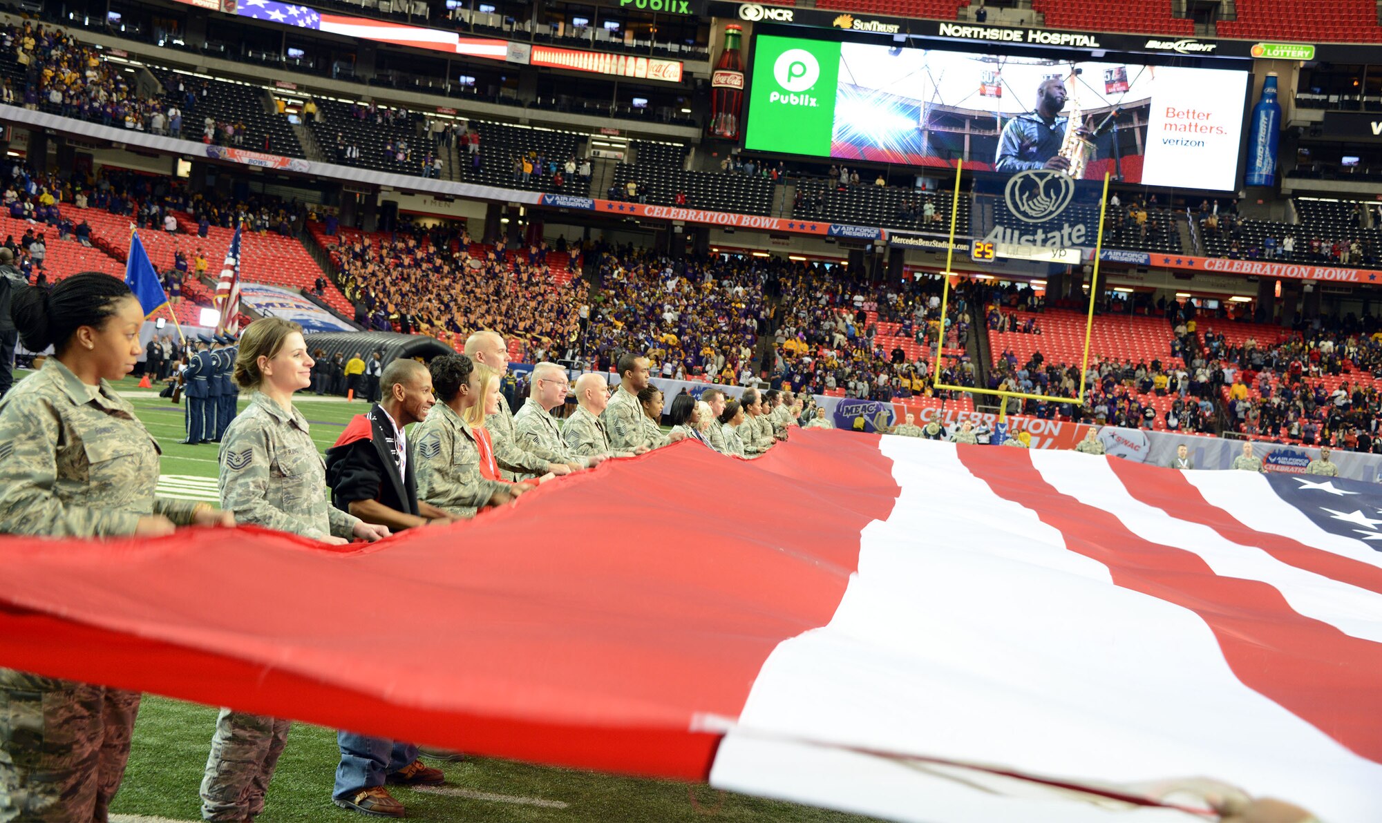 A team of 60 Air Force Reservist's and family members hold the American flag during the national anthem at the Air Force Reserve Celebration Bowl Dec. 19 at the Georgia Dome. (Air Force photo/Master Sgt. Chance Babin)