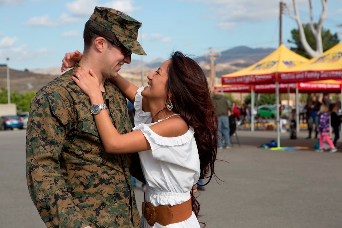 Sgt. Matthew G. Long is greeted by his girlfriend, Evangelyn Rubio Dec. 13, after a seven-month deployment with the 15th Marine Expeditionary Unit at Marine Corps Base Camp Pendleton, California. While deployed, the 15th MEU participated in more than 15 different theater security cooperation or bi-lateral exercises including combined arms and desert survival training with French forces in Djibouti, the Malaysia-US Amphibious Exercise, Combined Afloat Readiness and Training in Brunei, and more than 12 subject matter expert exchanges with partner nations throughout the Middle East. Long is a machine gunner with Lima Company, 3rd Battalion, 1st Marine Regiment, 1st Marine Division, I Marine Expeditionary Force. (Marine Corps photo by Cpl. April L. Price/ Released)