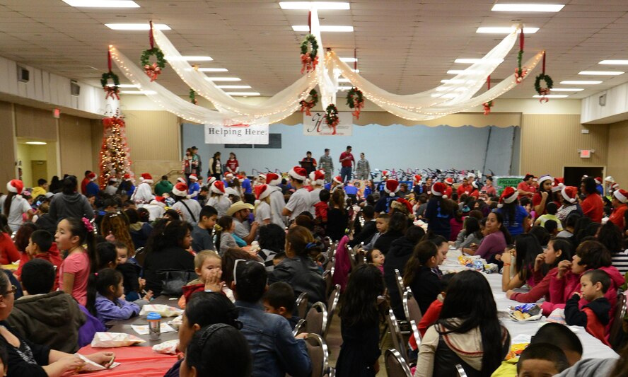 People gathered during the annual Niños Navideños event at the Civic Center in Del Rio, Texas, Dec. 19, 2015. More than 800 local youth and their parents attended the gift-giving event. (U.S. Air Force photo by Airman 1st Class Ariel D. Partlow)