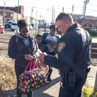 Military police and civilian law enforcement officers with Security Battalion, Marine Corps Base Quantico, check the identification of people who enter the base from the Virginia Railway Express station in the Town of Quantico. Security Battalion Marines routinely conduct random ID checks on people who ride the VRE trains and access the base through the Town of Quantico. In an effort to increase the security of the base and the safety of the people who work aboard the base, Security Battalion Marines maintain increased awareness at base access points.