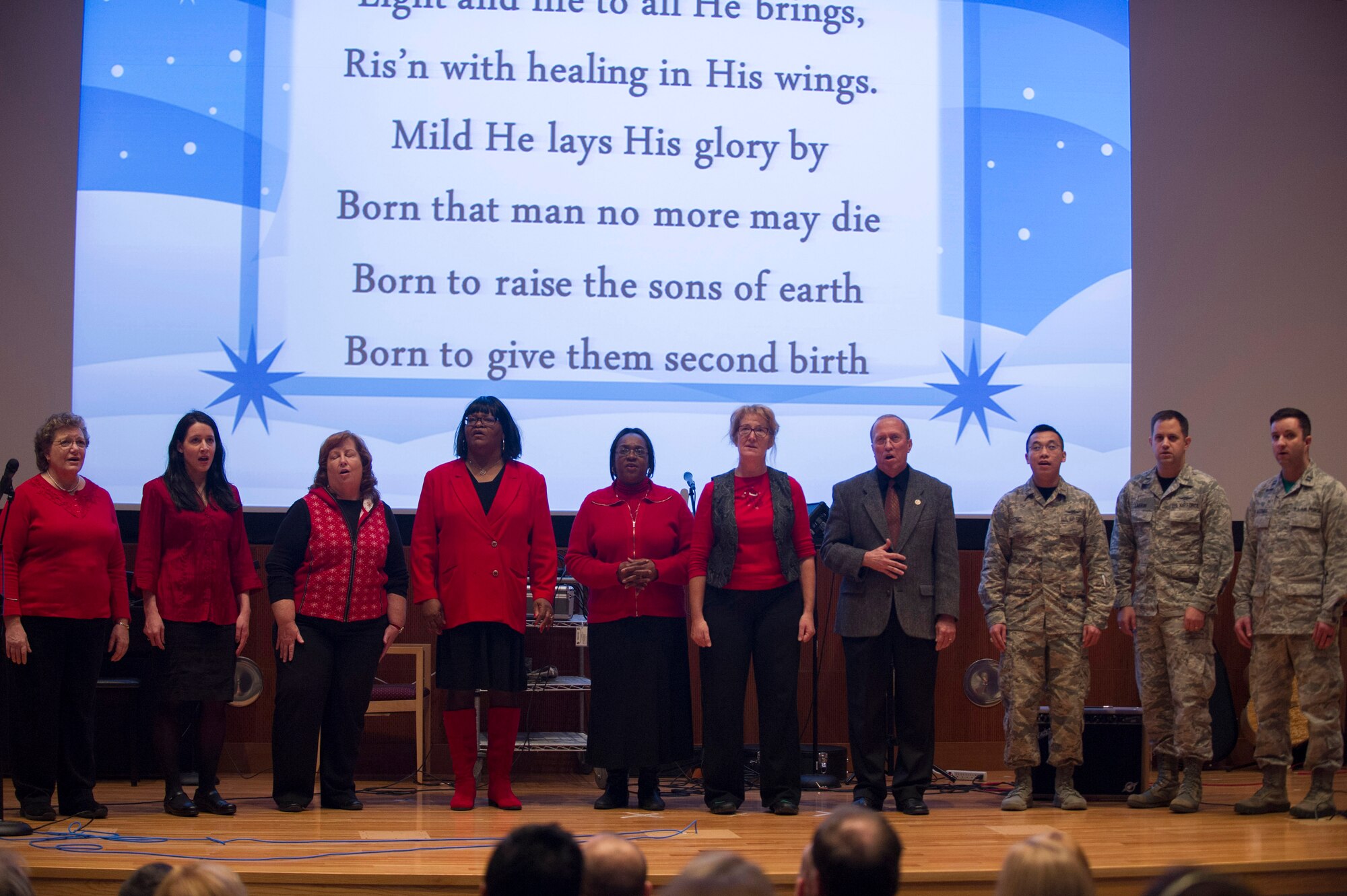 Members of the National Air and Space Intelligence Center Choir sign a Holiday medley during the Center’s annual talent show at Wright-Patterson Air Force Base, Ohio, Dec. 11, 2015. The talent show audience is made up of NASIC staff and their family members because the event takes place during NASIC’s open house. (U.S. Air Force Photo by Senior Airman Justyn M. Freeman)
