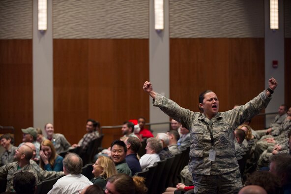 U.S. Air Force Lt. Col. Angelina Maguinness, National Air and Space Intelligence Center, belts out part of the “12 Days of Christmas” song during the Center’s annual talent show at Wright-Patterson Air Force Base, Ohio, Dec. 11, 2015. The talent show is part of the festivities during the NASIC annual open house. (U.S. Air Force Photo by Senior Airman Justyn M. Freeman)  