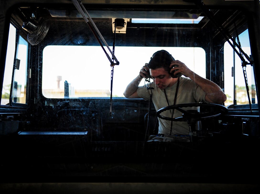 Senior Airman Kristopher Benfer, a crew chief with the 1st Special Operations Aircraft Maintenance Squadron, prepares to tow an AC-130U Spooky Gunship for routine maintenance at Hurlburt Field, Fla., Dec. 15, 2015. Primary missions of the AC-130U are close air support, air interdiction and armed reconnaissance. (U.S. Air Force photo by Senior Airman Meagan Schutter)