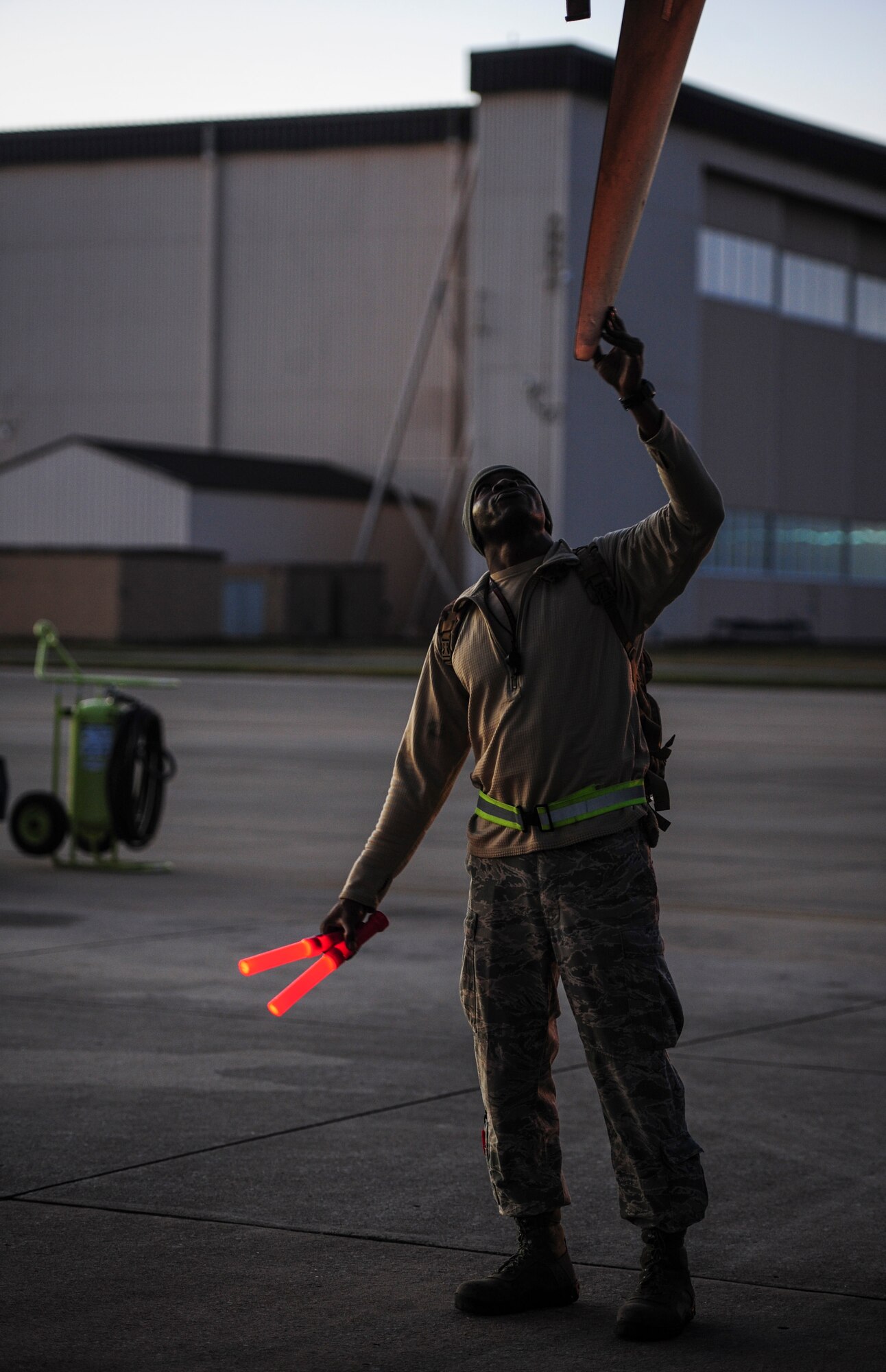 Senior Airman Antwain Parker, a crew chief with the 1st Special Operations Aircraft Maintenance Squadron, positions an AC-130U Spooky Gunship propeller before a schedule tow at Hurlburt Field, Fla., Dec. 15, 2015. Crew chiefs with the 4th Aircraft Maintenance Unit are trained to diagnose malfunctions on the AC-130U Spooky Gunship during pre-flight and post-flight inspections, repair and refuel the aircraft, keep detailed records, marshal aircraft, to remain mission ready at all times. (U.S. Air Force photo by Senior Airman Meagan Schutter)