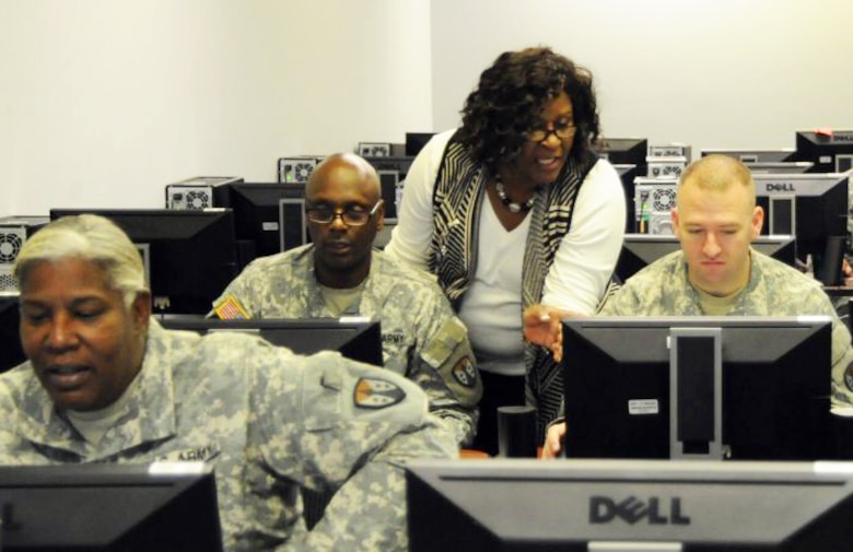 Shirley Burke-Mitchell provides Corps of Engineers Financial Management System training to Reserve Soldiers training at the U.S. Army Engineering and Support Center, Huntsville. A cadre of Huntsville Center acquisition specialists with expertise in a variety of procurement areas volunteered to provide the training the Soldiers require prior to their deployment in 2016.