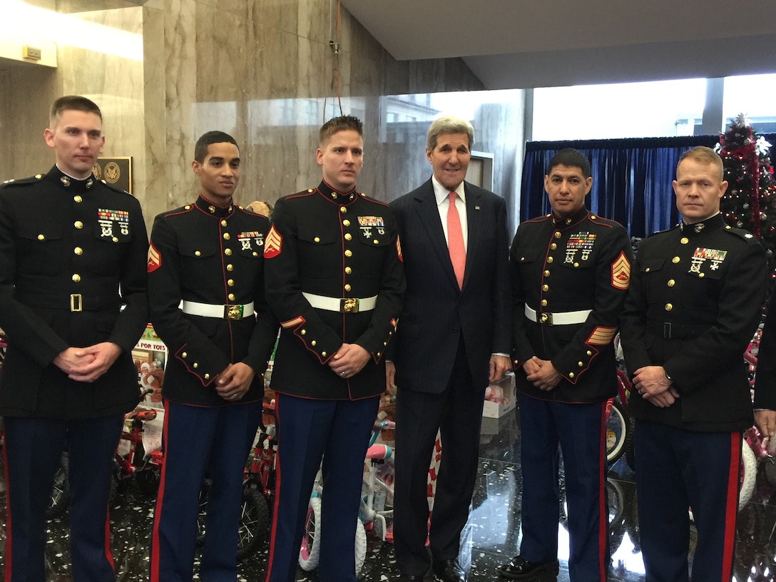 Marines from Marine Forces Reserve pose for a photo with Secretary of State John Kerry at a Toys for Tots event in Arlington, Va., Dec. 17, 2015. Toys for Tots was established in 1947 by the Marine Corps Reserve and provides new, unwrapped toys to millions of children in communities across the country every year. (U.S. Marine Corps photo by Master Sgt. Bryan Tupaz)