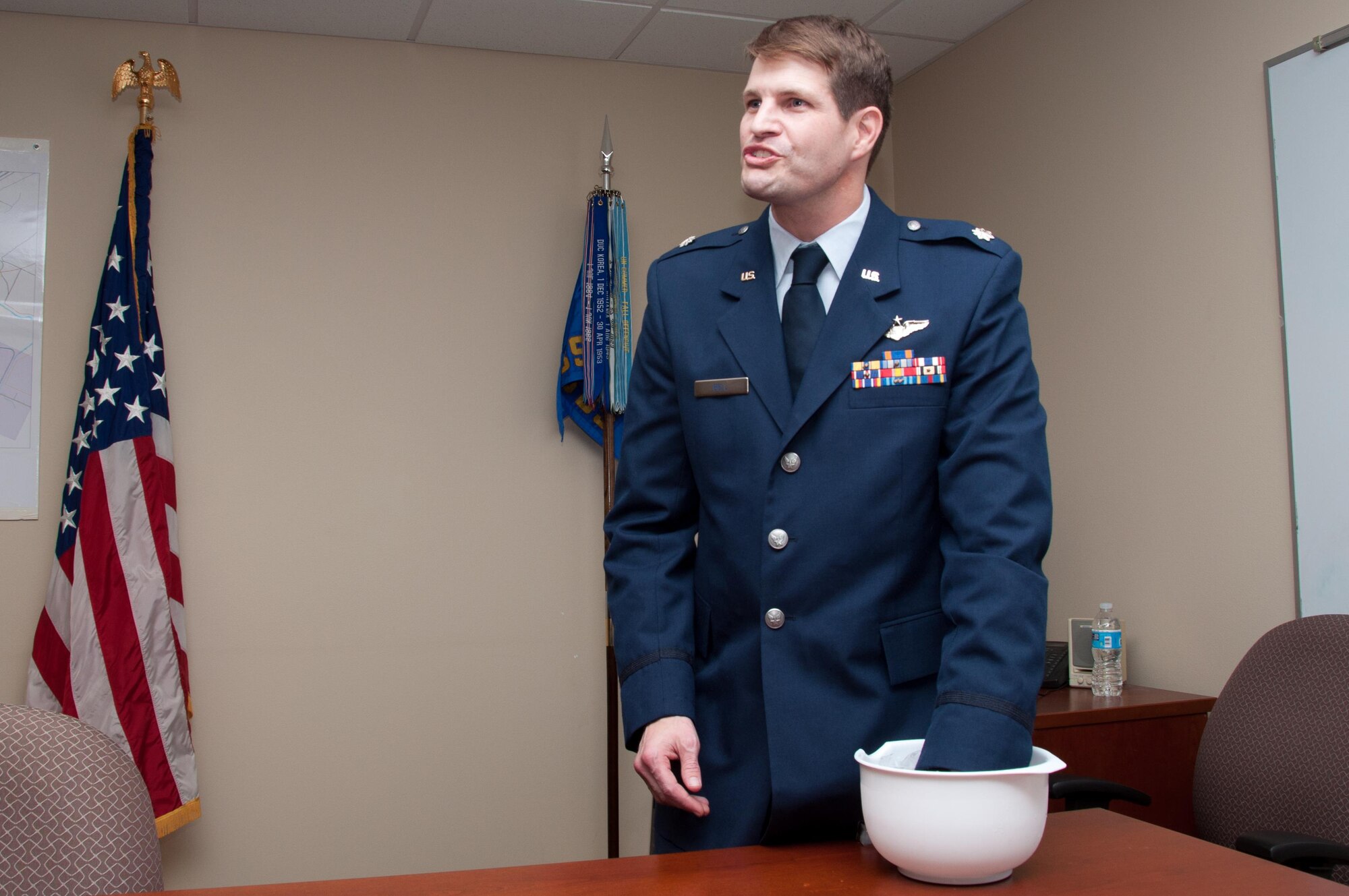 U.S. Air Force Lt. Col. Landon Bell, 343rd Bomb Squadron Assistant Director of Operations, makes his acceptance speech after pinning on Lt. Col. at Barksdale Air Force Base, La., on Dec. 11, 2015. Prior to the ceremony he stated he would not speak longer than he could keep his hand in a bowl full of ice. (U.S. Air Force photo by Master Sgt. Laura Siebert/Released)