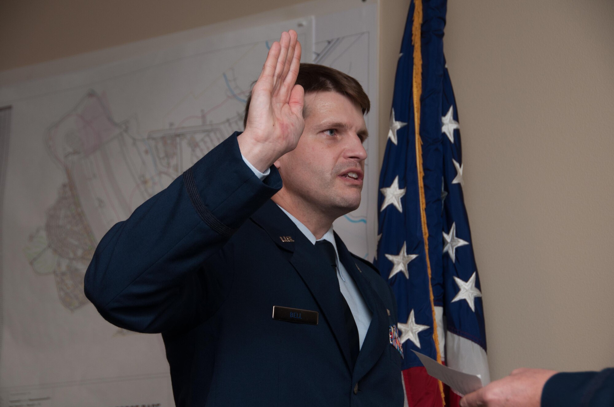 U.S. Air Force Lt. Col. Landon Bell, 343rd Bomb Squadron Assistant Director of Operations, takes the Oath during a promotion ceremony at Barksdale Air Force Base, La., on Dec. 11, 2015. Bell is a navigator in the B-52 Stratafortress. (U.S. Air Force photo by Master Sgt. Laura Siebert/Released)