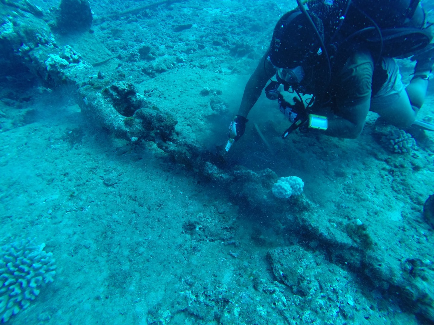 150821-N-ZZ999-001 BARKING SANDS, Hawaii (August 20, 2015) Utilitiesman 2nd Class Eric Martin, assigned to Underwater Construction Team (UCT) 2, verifies a mooring chain and shackle on an anchor point that will be used during cable splicing operations to allow a cable ship to anchor at a specific location. UCT 2's Construction Dive Detachment Charlie (CDDC) is performing subsea cable maintenance at the Pacific Missile Range Facility. CDDC Is on the first stop of their deployment, where they are conducting inspection, maintenance and repair of various underwater and waterfront facilities in support of the Pacific Fleet. (U.S. Navy photo by Builder 2nd Class Dave Madmon/Released)