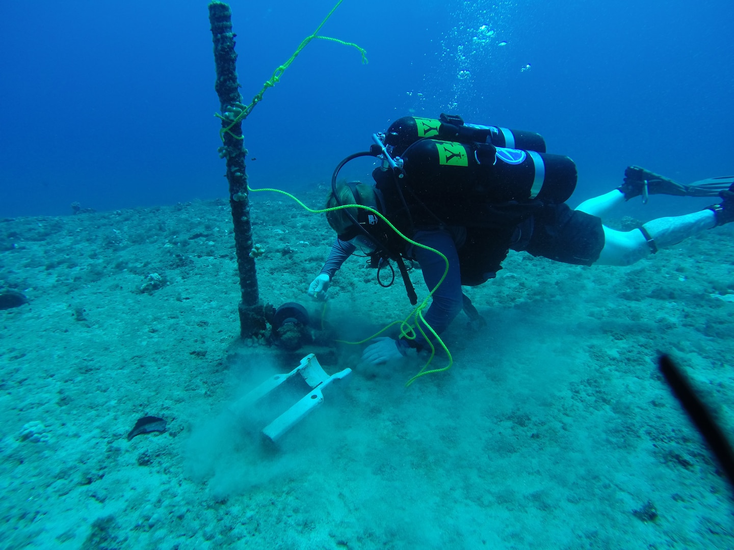 150820-N-ZZ999-001 BARKING SANDS, Hawaii (Aug. 20, 2015) Builder 2nd Class Joseph Hophan, assigned to Underwater Construction Team (UCT) 2, verifies an anchor point in 110 feet of seawater that will be used during cable splicing operations to allow a cable ship to anchor at a specific location. UCT 2's Construction Dive Detachment Charlie (CDDC) is performing subsea cable maintenance at the Pacific Missile Range Facility. CDDC Is on the first stop of their deployment, where they are conducting inspection, maintenance and repair of various underwater and waterfront facilities in support of the Pacific Fleet. (U.S. Navy photo by Builder 2nd Class Dave Madmon/Released)    