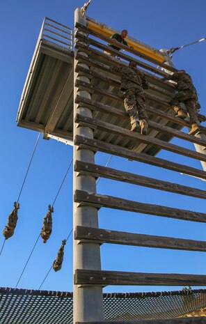 Recruits of Bravo Company, 1st Recruit Training Battalion, participate in the Slide for Life obstacle during Confidence Course II at Marine Corps Recruit Depot San Diego, Dec. 15. Many of the obstacles test the recruits’ confidence and mental strength in overcoming the challenges before them. Today, all males recruited west of the Mississippi are trained at MCRD San Diego. The depot is responsible for training more than 16,000 recruits annually. Bravo Company is scheduled to graduate Feb. 12.