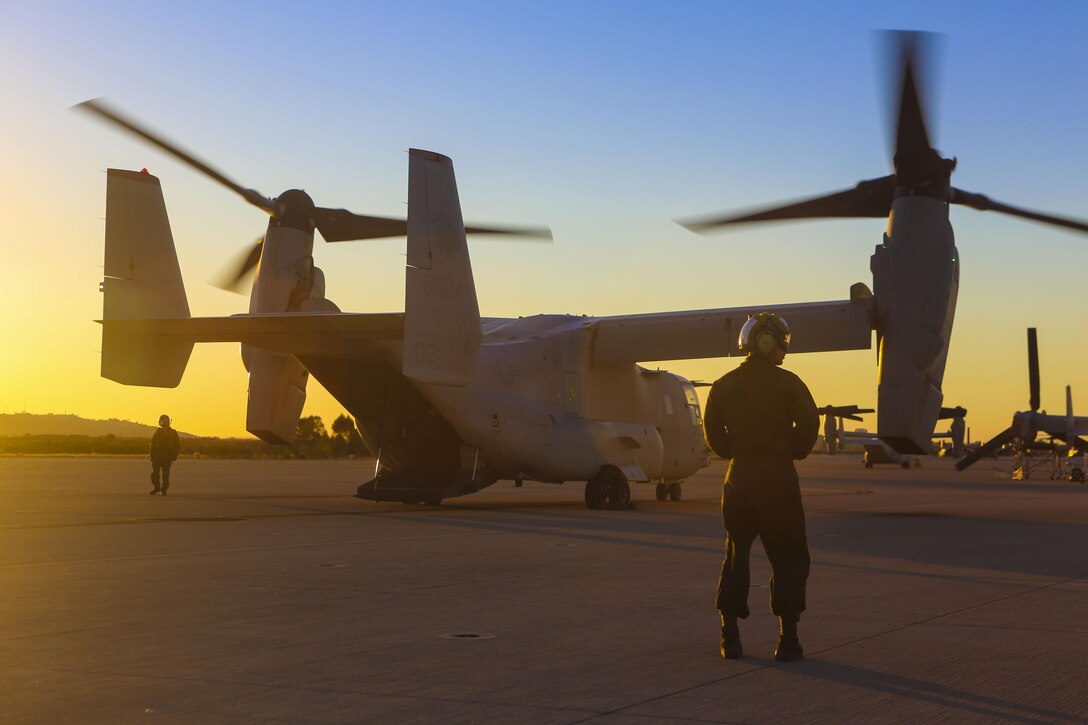 Marines with Marine Medium Tiltrotor Squadron 363 perform post-flight checks on an MV-22B Osprey after an aerial refueling training event aboard Marine Corps Air Station Miramar, Calif., Dec. 16. The squadron conducts this annual training once every two months to maintain their proficiency with the maneuvers. (U.S. Marine Corps photo by Lance Cpl. Harley Robinson/Released)