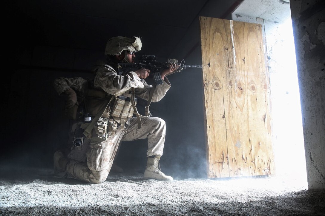 A Marine provides suppressing fire during the mechanized assault portion of a Marine Corps Combat Readiness Exercise at Marine Corps Air Ground Combat Center Twentynine Palms, Calif., Dec. 3, 2015. The purpose of a MCCRE is to evaluate Marines’ collective performance in specific mission requirements that will prepare them for their upcoming deployment rotation. The Marine is with 2nd Battalion, 7th Marine Regiment, 1st Marine Division. (U.S. Marine Corps photo by Lance Cpl. Devan K. Gowans)