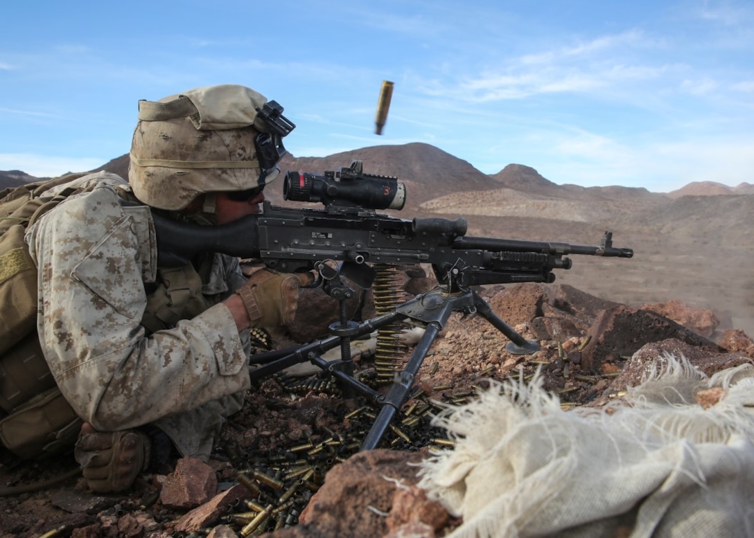 Pfc. Garrett Beck fires an M240B medium machine gun at distant targets during the company supported, live-fire assault portion of a Marine Corps Combat Readiness Evaluation at Marine Corps Air Ground Combat Center Twentynine Palms, Calif., Dec. 7, 2015 The purpose of a MCCRE is to evaluate Marines’ collective performance in specific mission requirements that will prepare them for their upcoming deployment rotation. Beck is a machine gunner with Company F, 2nd Battalion, 7th Marine Regiment, 1st Marine Division. (U.S. Marine Corps photo by Lance Cpl. Devan K. Gowans)