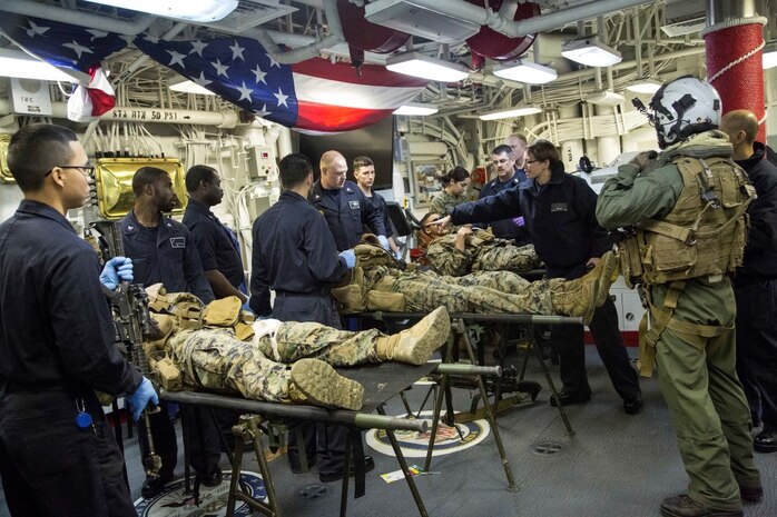 At sea. (Dec. 15, 2015) -U.S Marines and Sailors with the 13th Marine Expeditionary Unit (MEU) and Boxer Amphibious Ready Group, conduct a simulated casualty evacuation as part of an ongoing amphibious assault during certification exercise (CERTEX), at sea, Dec. 15, 2015.  CERTEX is the final evaluation of the 13th MEU prior to deployment and is intended to certify their readiness to conduct missions across the full spectrum of military operations. (U.S Marine Corps photo by Cpl. Briauna Birl/RELEASED)
