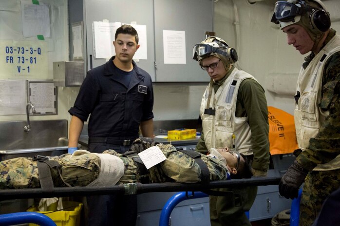 At sea. (Dec. 15, 2015) -A U.S Marine with the 13th Marine Expeditionary Unit (MEU), is transported to the USS Boxer's patient care facility as Marines and Sailors conduct a simulated casualty evacuation as part of an ongoing amphibious assault during certification exercise (CERTEX), at sea, Dec. 15, 2015.  CERTEX is the final evaluation of the 13th MEU prior to deployment and is intended to certify their readiness to conduct missions across the full spectrum of military operations. (U.S Marine Corps photo by Cpl. Briauna Birl/RELEASED)