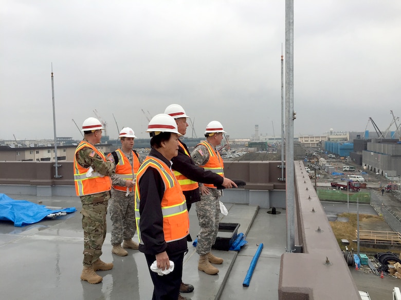 Lee Seeba, program director and resident engineer for the U.S. Army Corps of Engineers, Japan District’s Iwakuni Resident Office provides an overview of ongoing construction projects at Marine Corps Air Station Iwakuni, Japan to Maj. Gen. Mark Yenter, deputy commanding general for Military and International Operations, Headquarters, U.S. Army Corps of Engineers and Eugene Ban, programs director for the Pacific Ocean Division, U.S. Army Corps of Engineers. Also shown in Back: Col. John Hurley, commander, U.S. Army Corps of Engineers, Japan District and Capt. David Dawes, aide-de-camp to Maj. Gen. Yenter. USACE Photo.