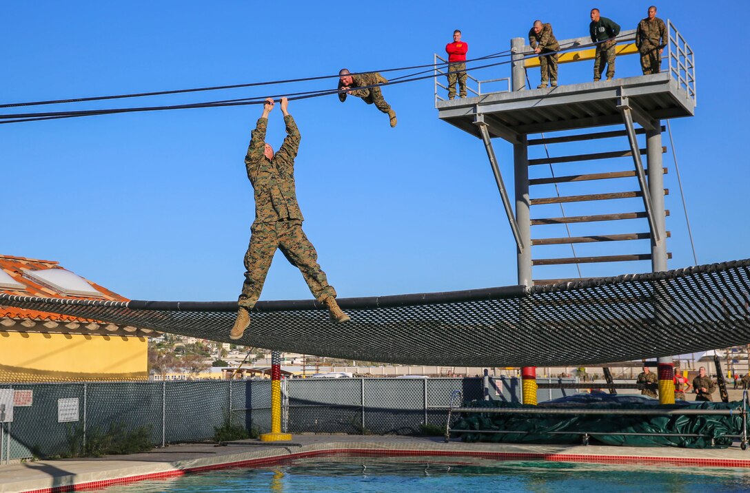 Marine Corps recruits participate in the Slide for Life obstacle on Marine Corps Recruit Depot San Diego, Dec. 15, 2015. The recruits are assigned to Bravo Company, 1st Recruit Training Battalion. Marine Corps photo by Lance Cpl. Angelica I. Annastas