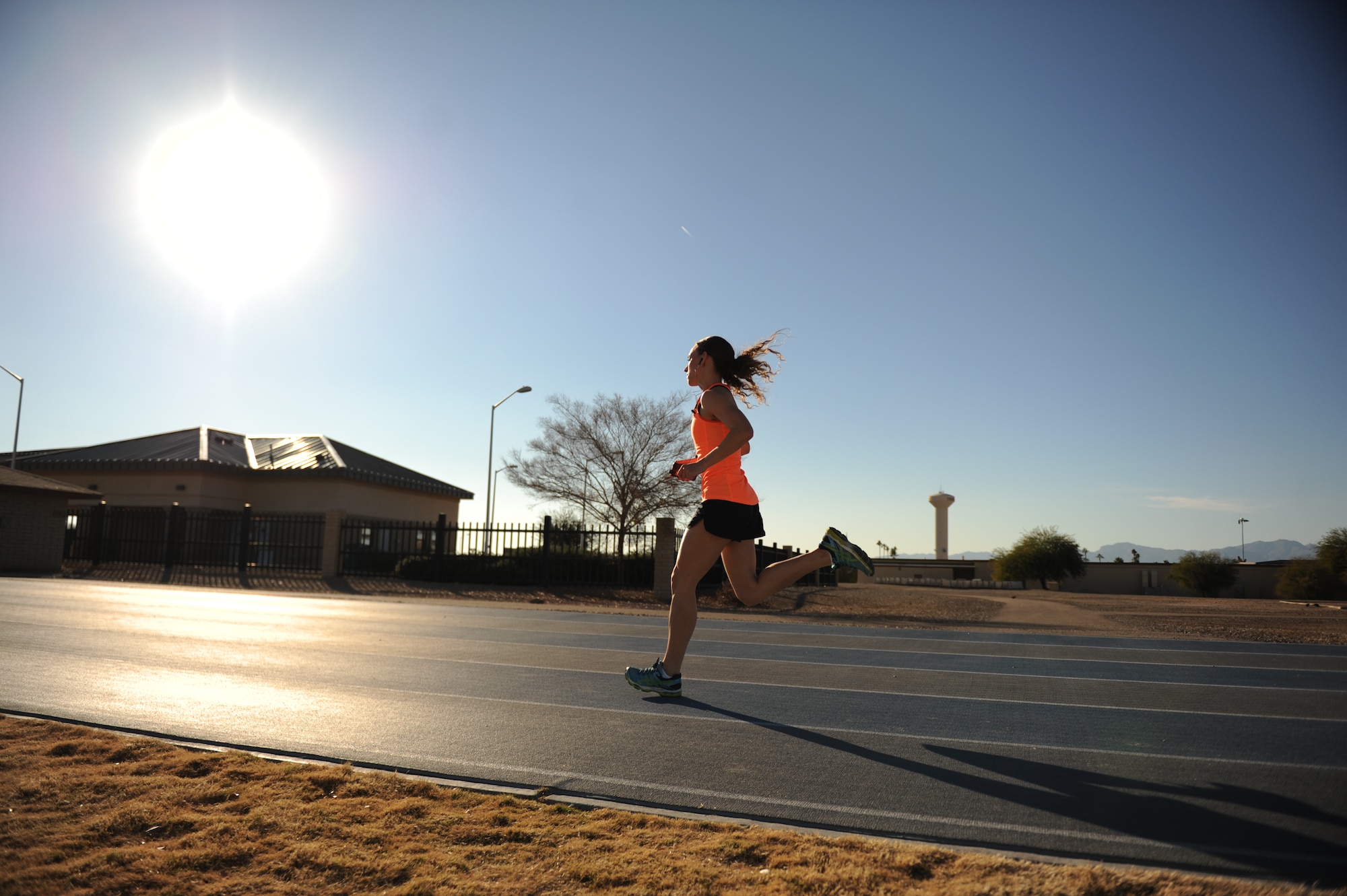 Senior Airman Melissa Franks, 56th Aerospace Medicine Squadron flight medicine medical technician, runs on the track at Luke Air Force Base, Ariz. Franks can run 1.5 miles in 9:15 and has placed first in all the 5-kilometer runs she’s attended at Luke in the female category. (U.S. Air Force photo by Senior Airman Grace Lee)
