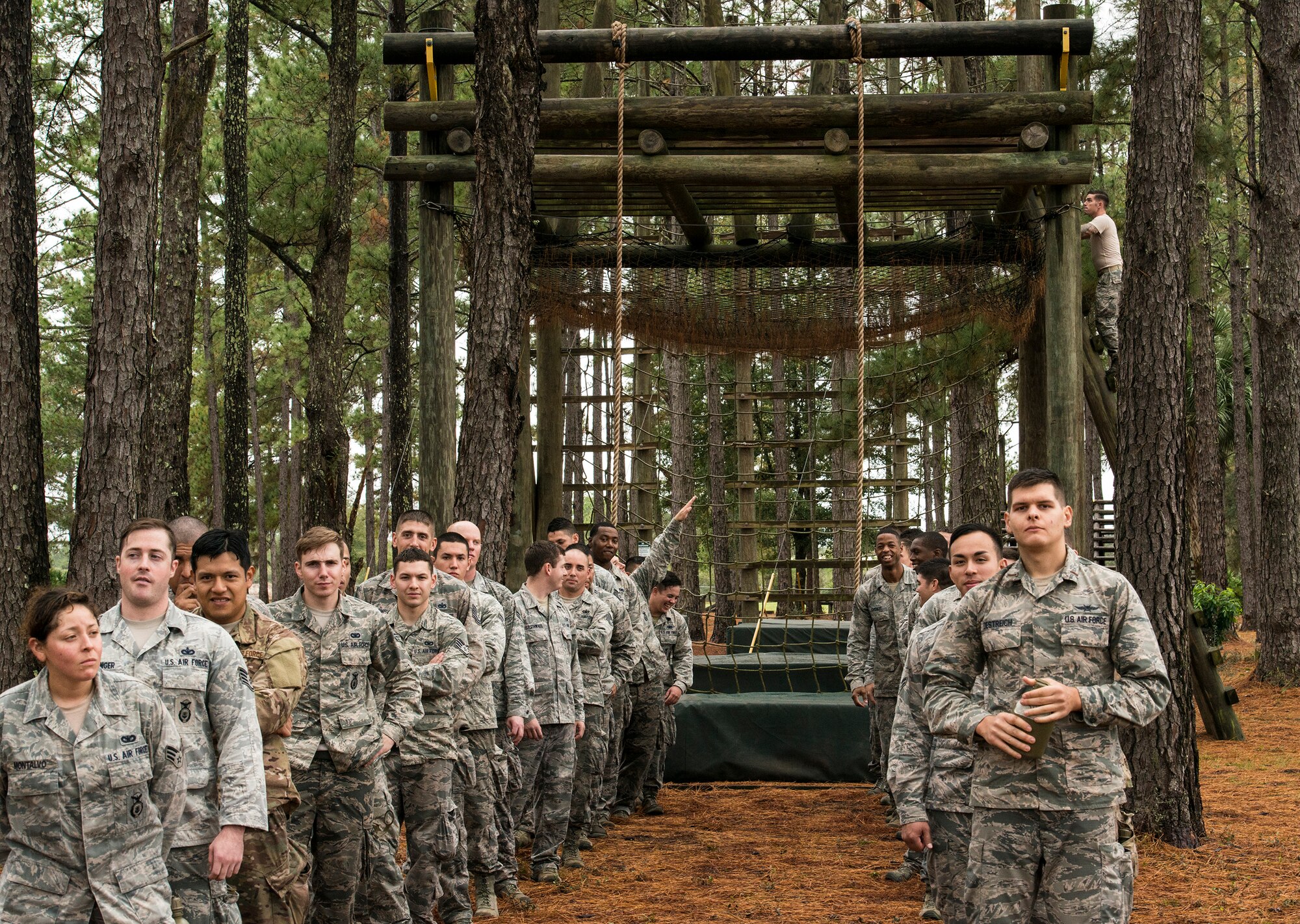 Airmen from the 820th Base Defense Group at Moody Air Force Base, Ga. and the 1st Special Operations Security Forces Squadron at Hurlburt Field, Fla., line up to start an obstacle course, Dec. 15, 2015, at Camp Blanding, Fla. The obstacle course consisted of nine obstacles such as rope climbs, rope swings, towers and low crawls. (U.S. Air Force photo by Airman 1st Class Lauren M. Johnson/Released)