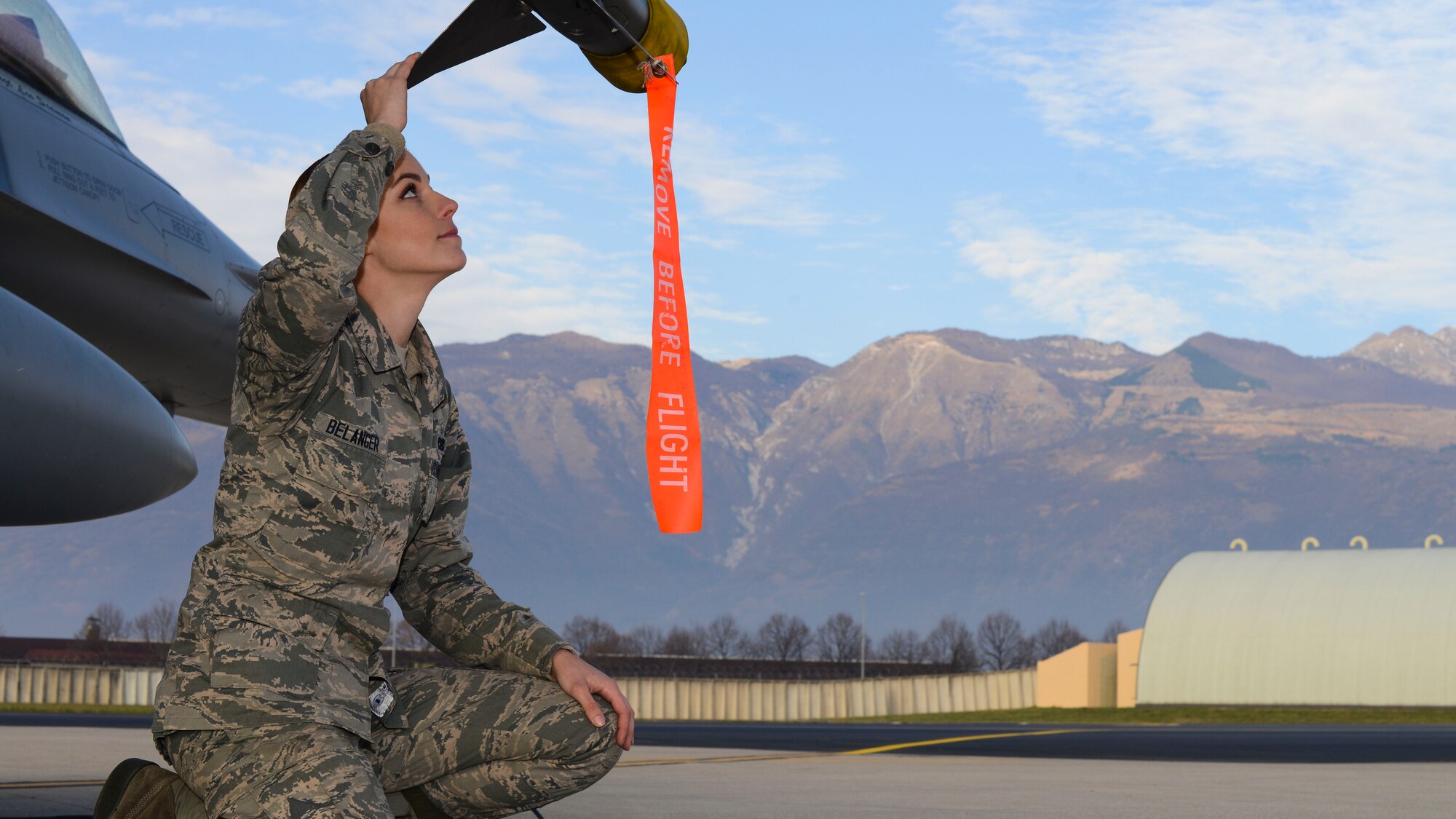 U.S. Air Force Airman 1st Class Danielle Belanger, 31st Aircraft Maintenance Squadron weapons load crew member, inspects a weapons load, Dec. 8, 2015, at Aviano Air Base, Italy. Belanger has deployed to multiple countries in support of mission operations. (U.S. Air Force photo by Senior Airman Austin Harvill/Released)