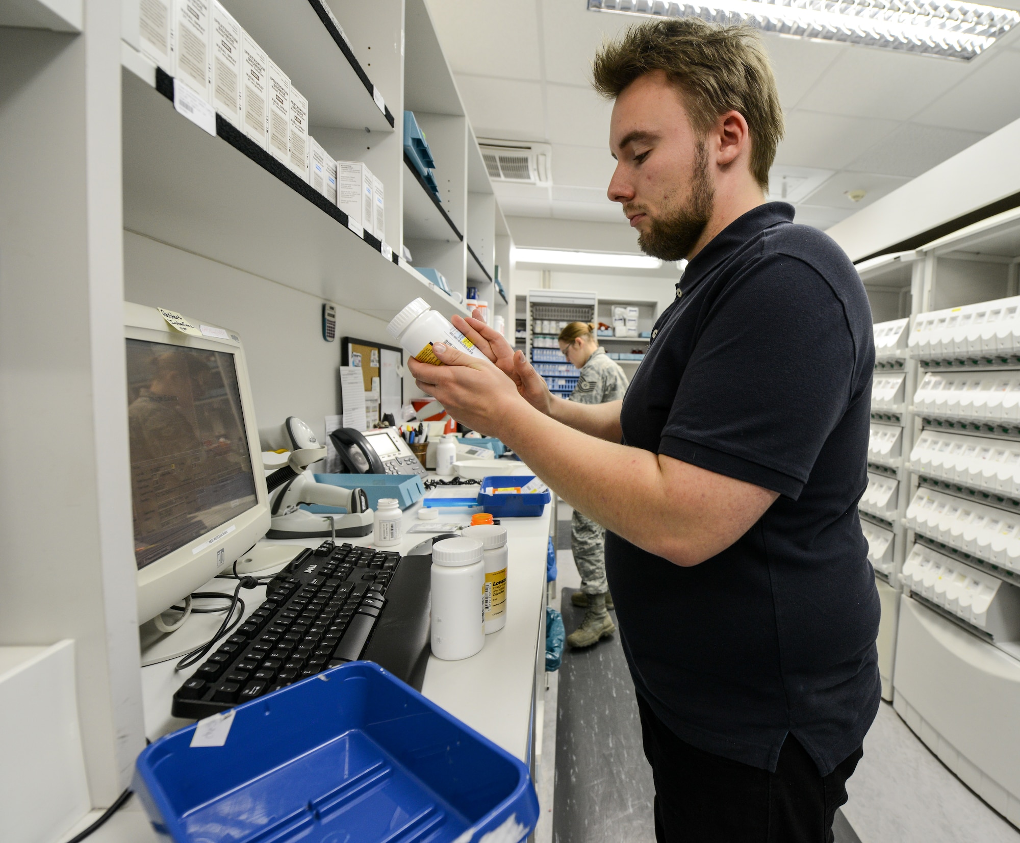 Ingmar Eckert, 86th Medical Support Squadron pharmacy technician, places a patient’s information on a bottle while filling a prescription at the Ramstein Air Base pharmacy, Dec. 15. Eckert takes several steps to verify the accuracy of the prescriptions for the safety of each patient. (U.S. Air Force photo/Staff Sgt. Leslie Keopka)