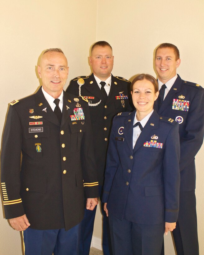 (l to r) U.S. Army Col.  Kevin Stevens, 8th Army deputy surgeon general, U.S. Army Staff Sgt. Joseph Stevens, 2nd Infantry Division crew chief, Capt. Jessica Adkins, 607th Air and Space Operations Center, and Maj. Jeffrey Adkins, 7th Air Force, pose for a recent family photo.  Capt. Adkins and her husband Jeffery, received a surprise earlier this year when her father and her brother were also stationed in Korea.  The family will spend the holiday
season together being stationed in the same place for the first time since she joined the Air Force.  (Courtesy photo)
