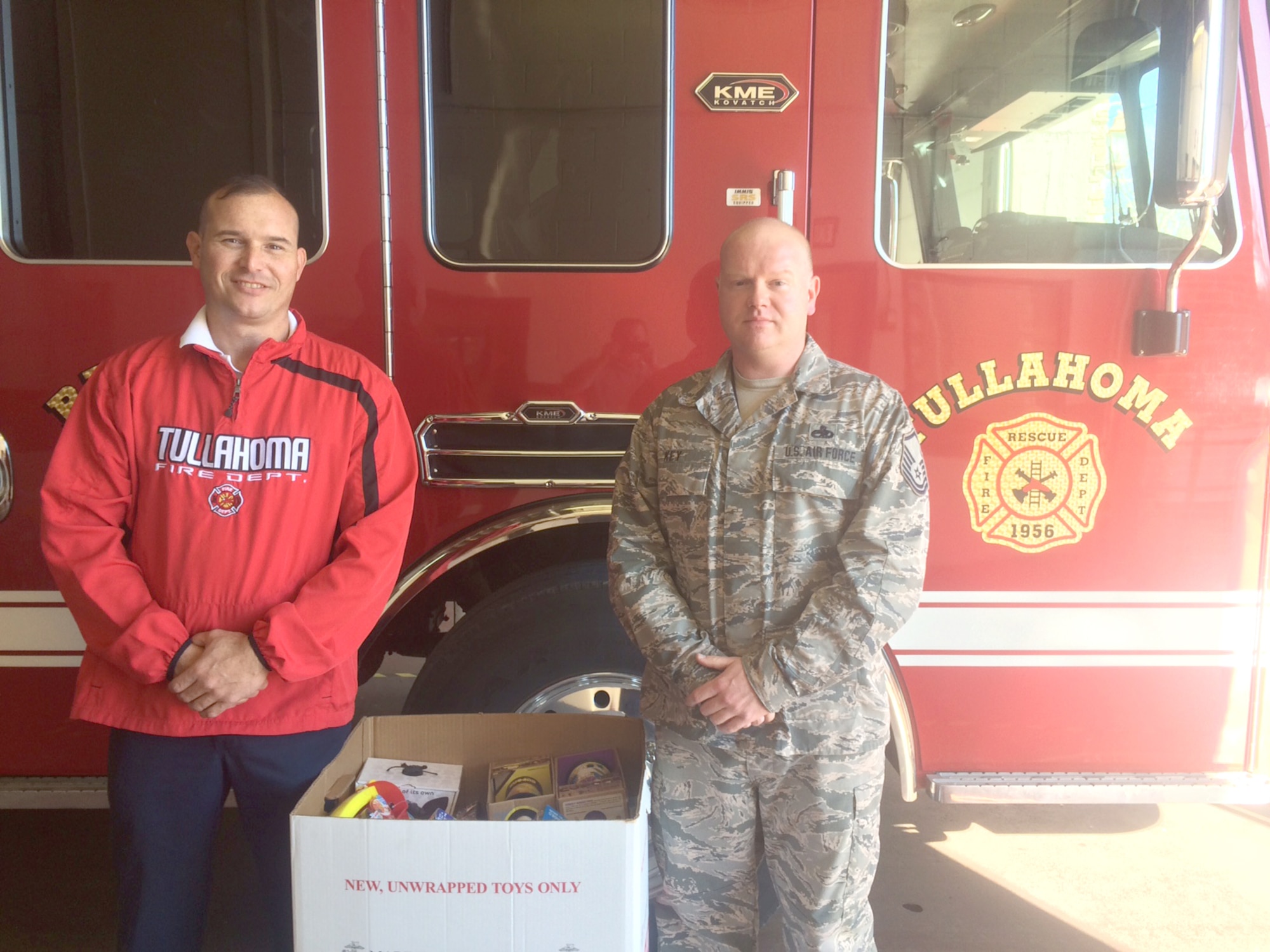As a way of giving back to the community this time of year, the charitable folks of AEDC purchased and donated unwrapped gifts for Toys for Tots, an organization which gives toys to children who might otherwise not receive gifts for Christmas. As part of the drive, sponsored by Air Force Sergeants Association at Arnold AFB, drop boxes were placed in two locations around the base. Pictured is Master Sgt. James Key (right) dropping the boxes of toys off with Capt. Ed Host of the Tullahoma Fire Department Dec. 14, 2015. The toys were then distributed to families by members of the fire department. (Courtesy photo)