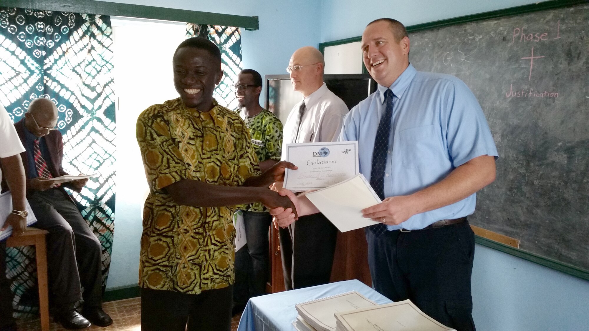 At the end of the weeklong studies, attendees of the Disciple Makers Multiplied conference receive a certificate and a reference book and take the curriculum they learned back to their home city. Pictured here is ATA Section Manager Tommy Northcott handing out a certificate to one of his students at the end of the conference. (Courtesy photo)