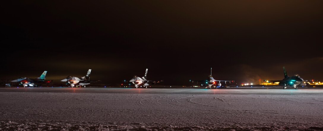 F-16 Fighting Falcon aircraft pilots wait to take off from Eielson Air Force Base, Alaska, Dec. 7, 2015. U.S. Air Force photo by Master Sgt. Joseph Swafford