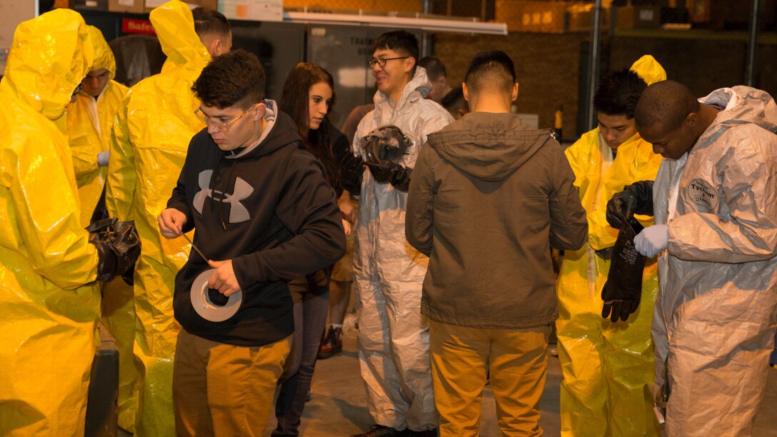 Marines from Marine Wing Support Squadron 171 dawn their personal protective equipment during Hazardous Waste Operations and Emergency Response training at Marine Corps Air Station Iwakuni, Japan, Dec. 18, 2015. Marines who have trained in HAZWOPER may translate their official certification into the civilian sector, giving this training more significance inside and outside the Corps. While it is mandatory for hazardous workers in the U.S. to undergo HAZWOPER training, it is not a requirement for all Marines.