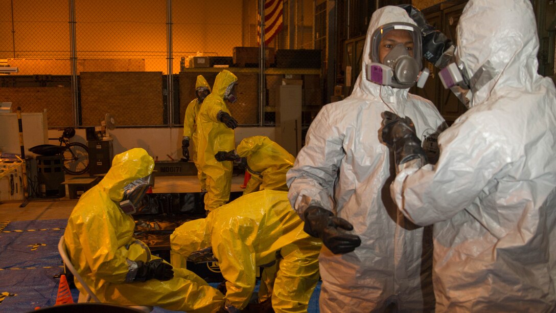 Marines from Marine Wing Support Squadron 171 proceed though a decontamination line during Hazardous Waste Operations and Emergency Response training at Marine Corps Air Station Iwakuni, Japan, Dec. 18, 2015. This course provides Marines with proper certification to handle any hazardous situation that may occur. Accurate training is instilled to ensure the Marines recognize and understand the importance of practice and its role in avoiding potential hazards.