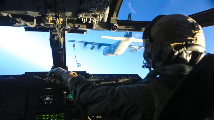 An MV-22B Osprey pilot with Marine Medium Tiltrotor Squadron (VMM) 363 maneuvers his aircraft into position during an aerial refueling exercise near Marine Corps Air Station Miramar, California, Dec. 16. The squadron conducts this annual training once every two months to maintain their proficiency with the maneuvers.