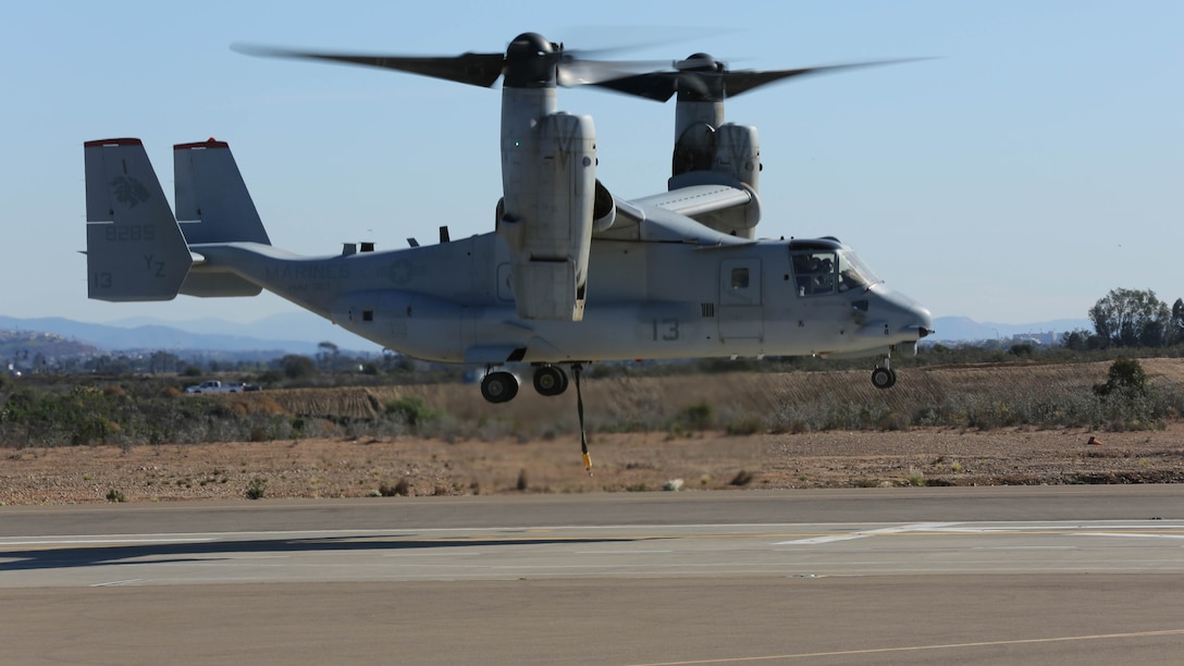 An MV-22B Osprey with Marine Medium Tiltrotor Squadron 363 takes off and begins daytime external lift training aboard Marine Corps Air Station Miramar, Calif., Dec. 16, 2015. Daytime external lift training prepares the Marines with VMM-363 to attach cargo to the aircraft which helps qualify more air crew in the mission-essential task of rapid insertion and extraction for the squadron. 