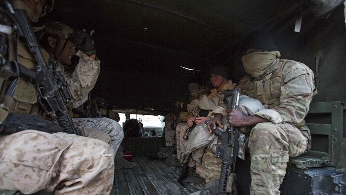 U.S. Marines with 1st Reconnaisance Battalion board a HUMVEE during Steel Knight 16 at Marine Corps Air Ground Combat Center Twentynine Palms, California, Dec. 11, 2015. Steel Knight is an annual field training exercise that enables 1st Marine Division to test and refine its command and control capabilities by acting as the headquarters element for a forward-deployed Marine Expeditionary Force.