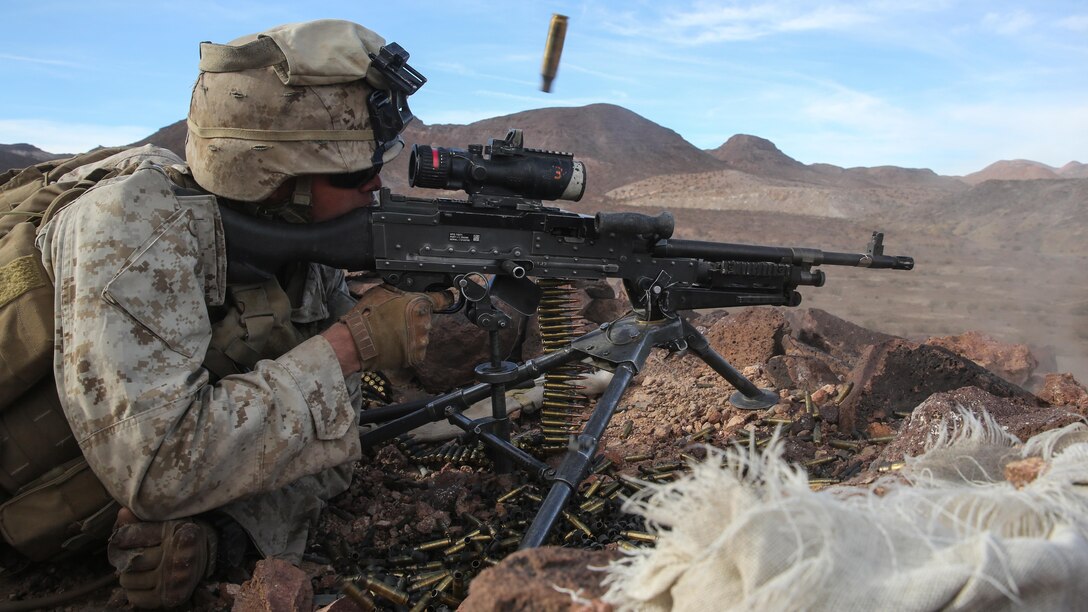 Pfc. Garrett Beck fires an M240B medium machine gun at distant targets during the company supported, live-fire assault portion of a Marine Corps Combat Readiness Evaluation at Marine Corps Air Ground Combat Center Twentynine Palms, California, Dec. 7, 2015 The purpose of a MCCRE is to evaluate Marines’ collective performance in specific mission requirements that will prepare them for their upcoming deployment rotation. Beck is a machine gunner with Company F, 2nd Battalion, 7th Marine Regiment, 1st Marine Division.