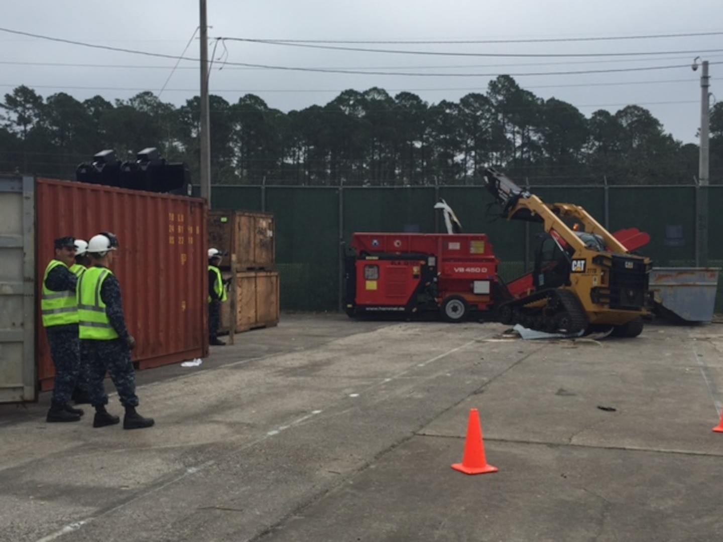 Members of Disposition Services Unit Six observe as shredding and material handling equipment operations are conducted to familiarize sailors with the platforms they may use in the field.  