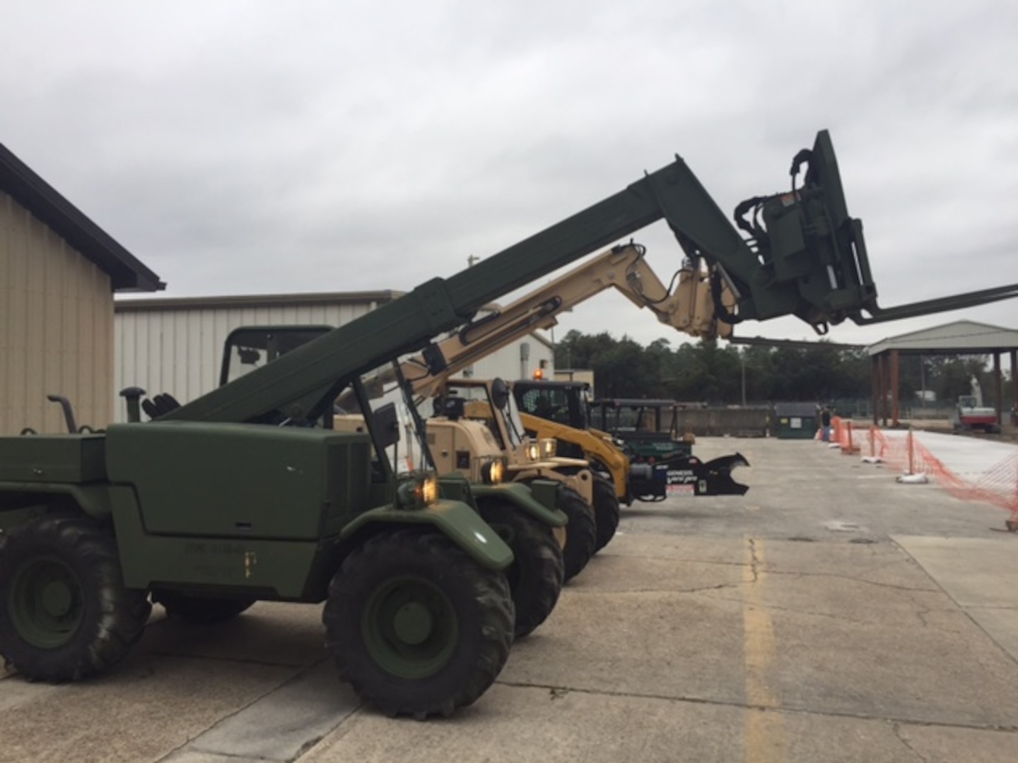 Forklifts stand ready for training with Disposition Services Unit Six sailors.