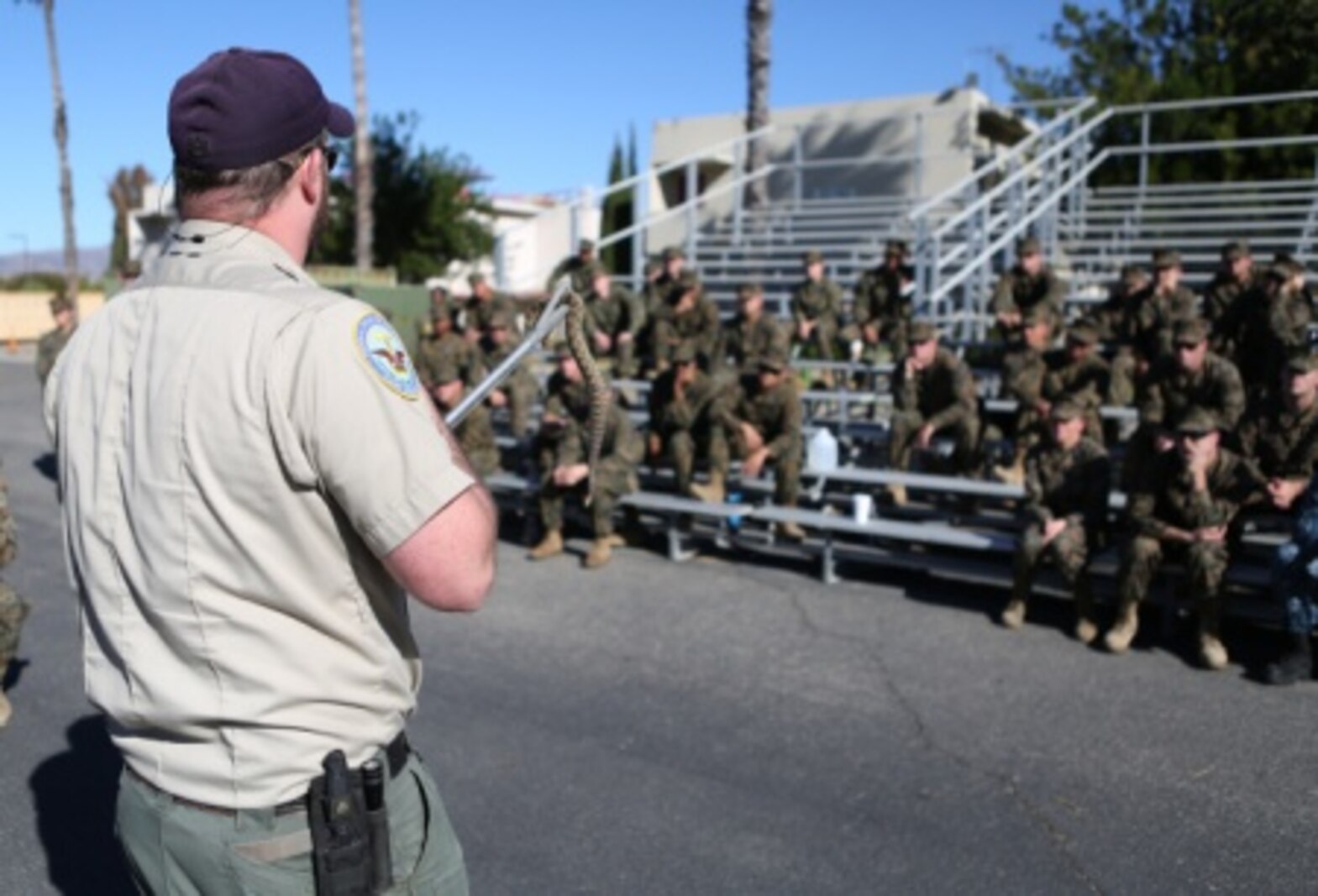 Sailors from 1st Medical Battalion, 1st Marine Logistics Group and various other units receive training from the Camp Pendleton Game Wardens Office about snakes and how to avoid harm from wildlife aboard Camp Pendleton, Calif., Nov. 19, 2015. Med. Bn. hosted a three-day training evolution with units across the western region to increase their readiness and proficiency in preventive medicine.