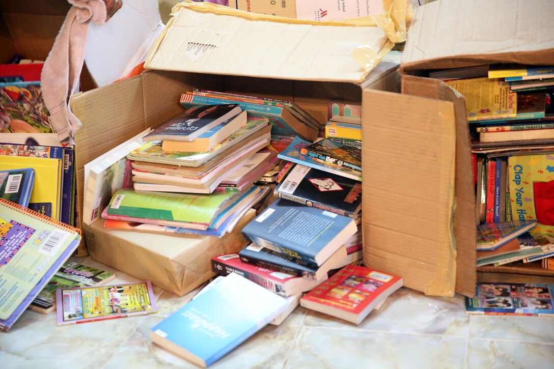 Books delivered by the USNS Walter S. Diehl await arrangement and delivery to schools in Chanthaburi, Thailand, Dec. 21, 2015. Military Sealift Command Far East and the Singapore Area Coordinator Community in Singapore donated more than 1,200 English books for Thai children. U.S. Navy photo by Grady T. Fontana
