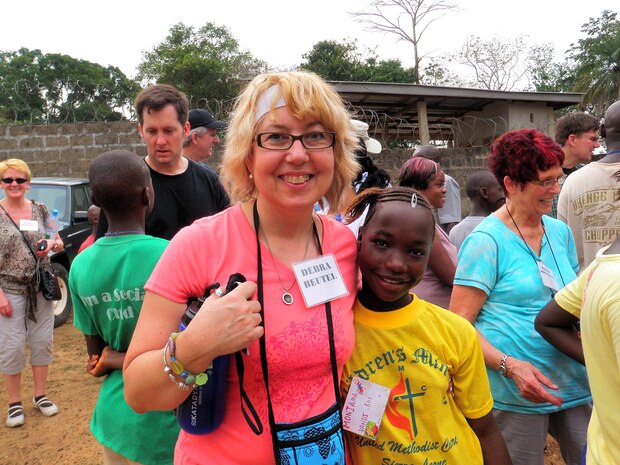 Deb Beutel, a deputy product manager in MCSC’s Marine Air Ground Task Force Command, Control and Communications, spends time with a young girl at a children’s center in Bo, Sierra Leone, where Deb and her husband Ken volunteer their time and professional skills to help children and families. Deb worked on projects including creating a library for the children at the center, providing medical outreach in nearby villages and delivering birthing kits to a local hospital. (Courtesy photo)