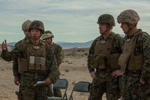 U.S. Marine Corps Maj. Sungwook Kim, left, 5th Marine Regiment intelligence officer, briefs Lt. Gen. David Berger, far right, commanding general of 1st Marine Expeditionary Force, during Steel Knight 16 at Marine Corps Air-Ground Combat Center, Twentynine Palms, Calif., Dec. 10, 2015. Steel Knight is an annual field training exercise that enables 1st Marine Division to test and refine its command and control capabilities by acting as the headquarters element for a forward-deployed Marine Expeditionary Force. (U.S. Marine Corps Combat Camera photograph by ( Lance Cpl. Roderick L. Jacquote)/RELEASED)